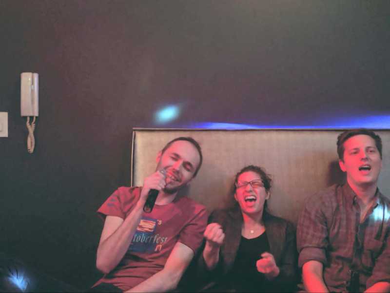 Marisa Morby, Dustin Schau, and Michał Piechowiak getting in on the Karaoke